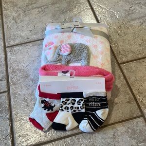 Plush baby blanket and baby socks.